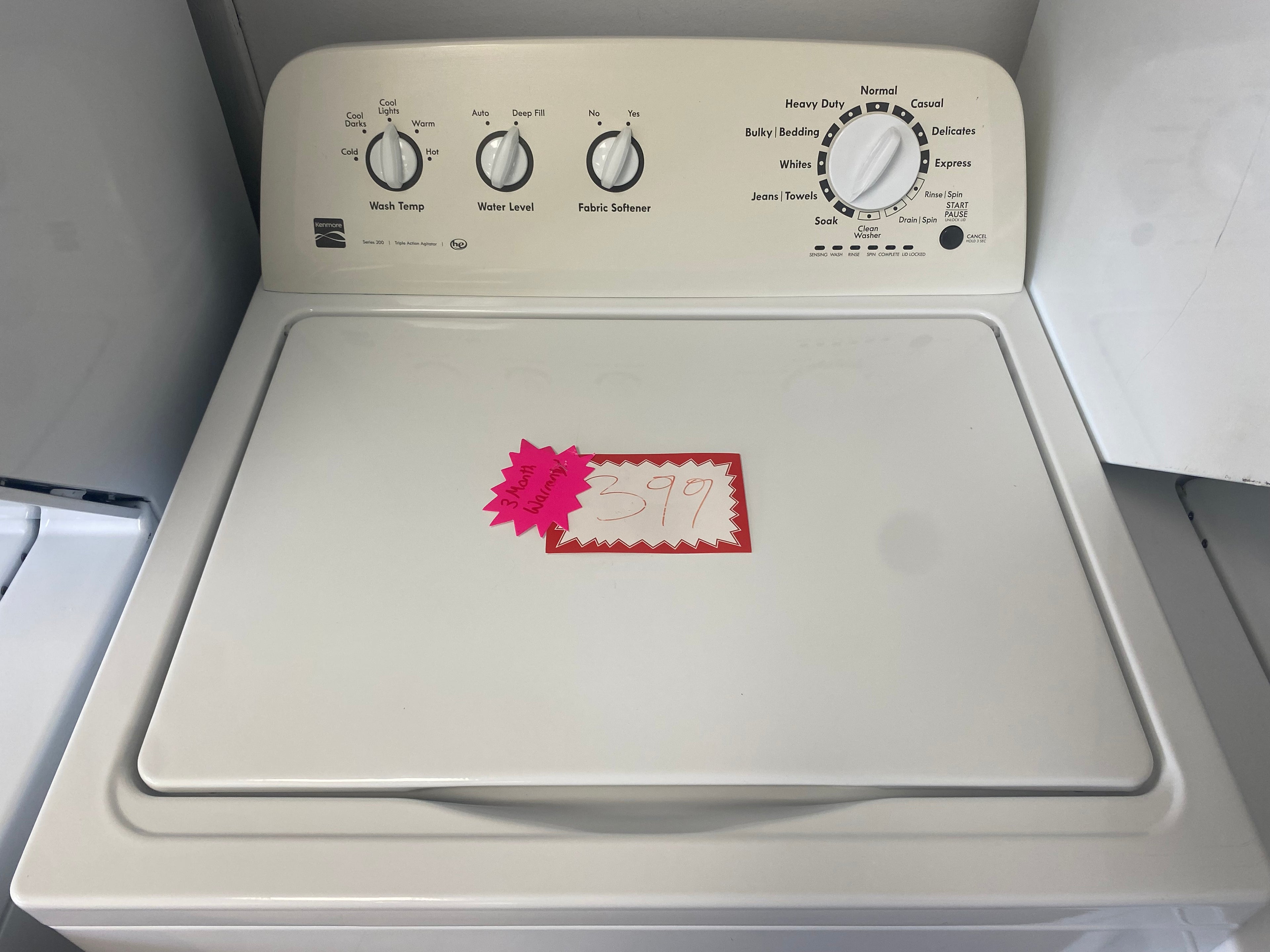 4.3 cuft, 27” top load white Kenmore washer with agitator he rated "refurbished"