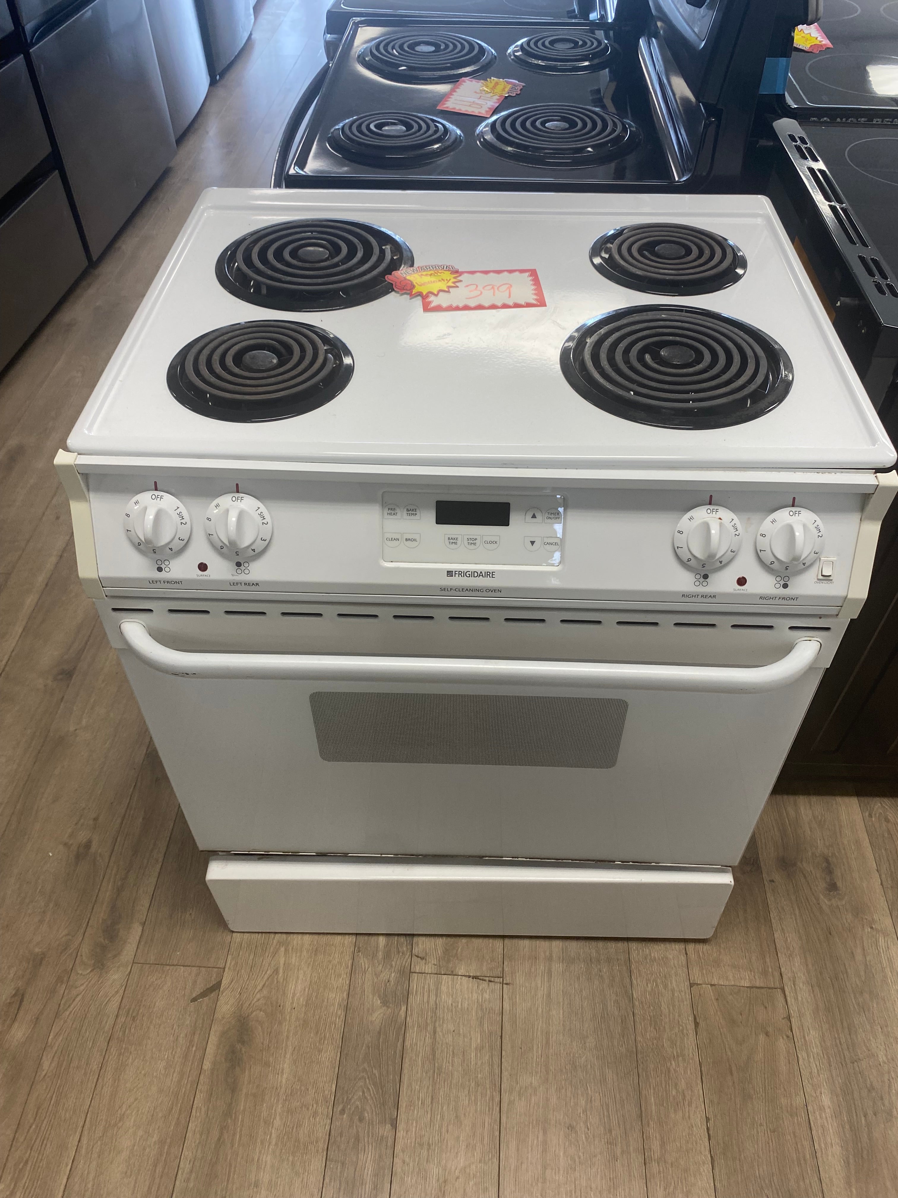 White 31” Frigidaire coil top slide in stove "refurbished"