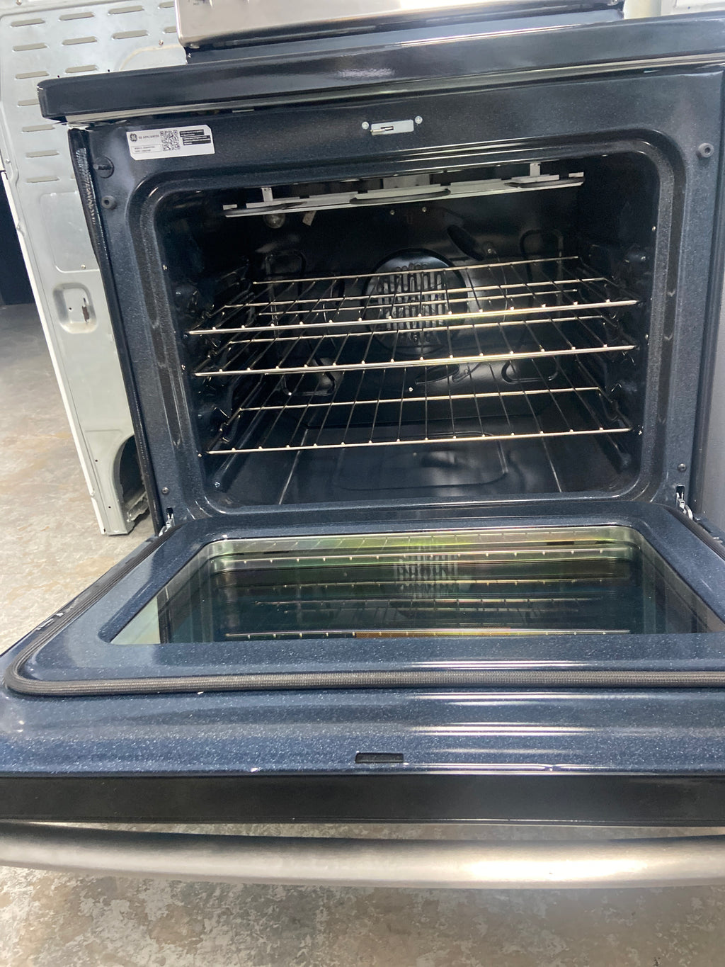 GE glass top stove, “Open Box”,  JCB840ST3SS , 5 burners including the warming zone burner, 6 Months Warranty