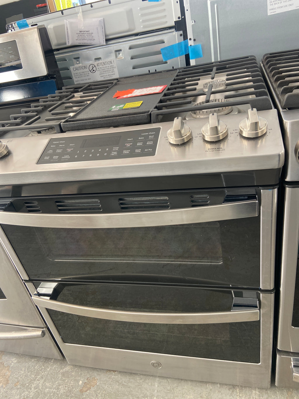 GE stainless slide in gas/propane double oven stove, JCGSS86SP2SS, “Open Box”, 6 Months Warranty