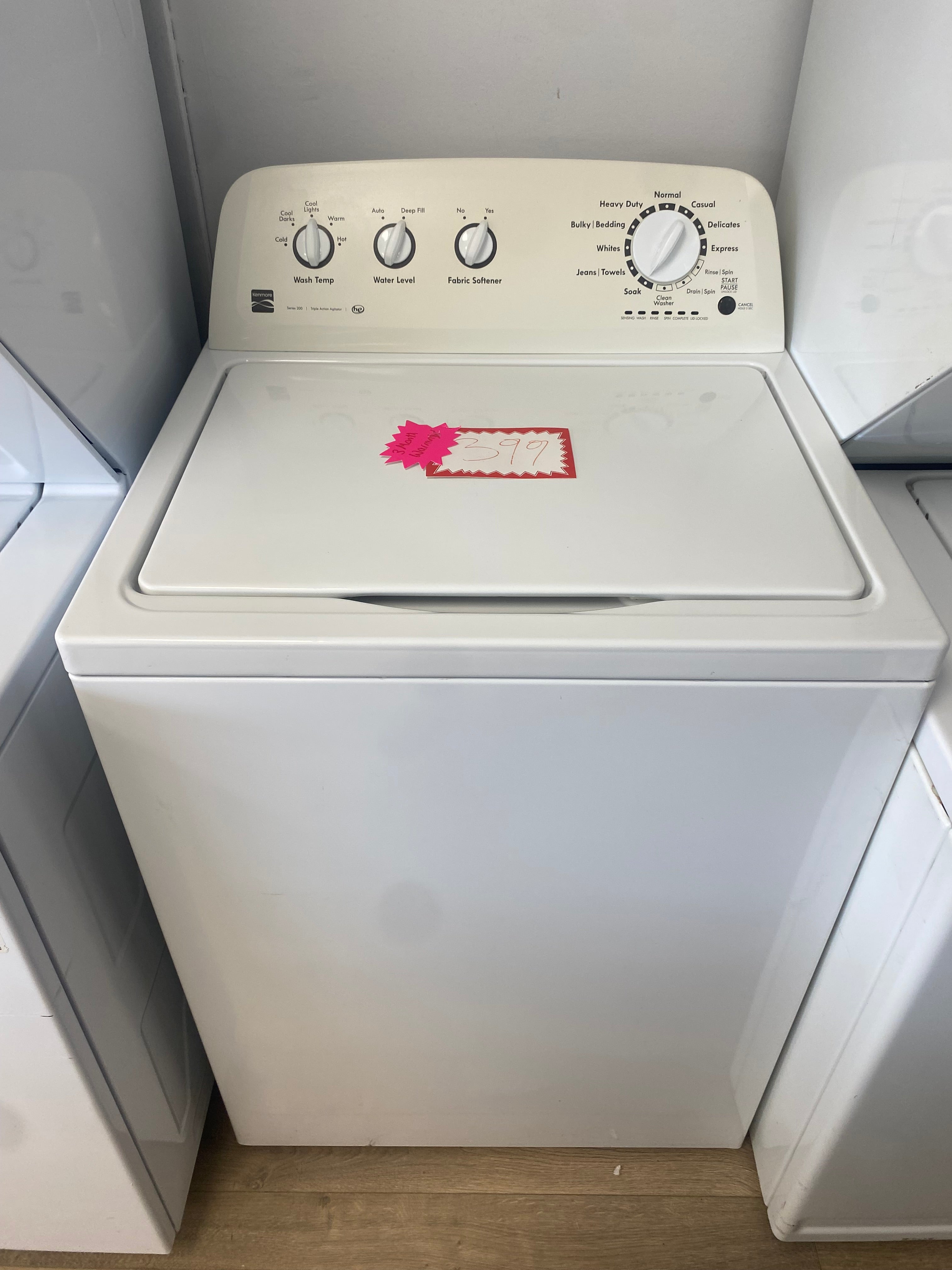 4.3 cuft, 27” top load white Kenmore washer with agitator he rated "refurbished"