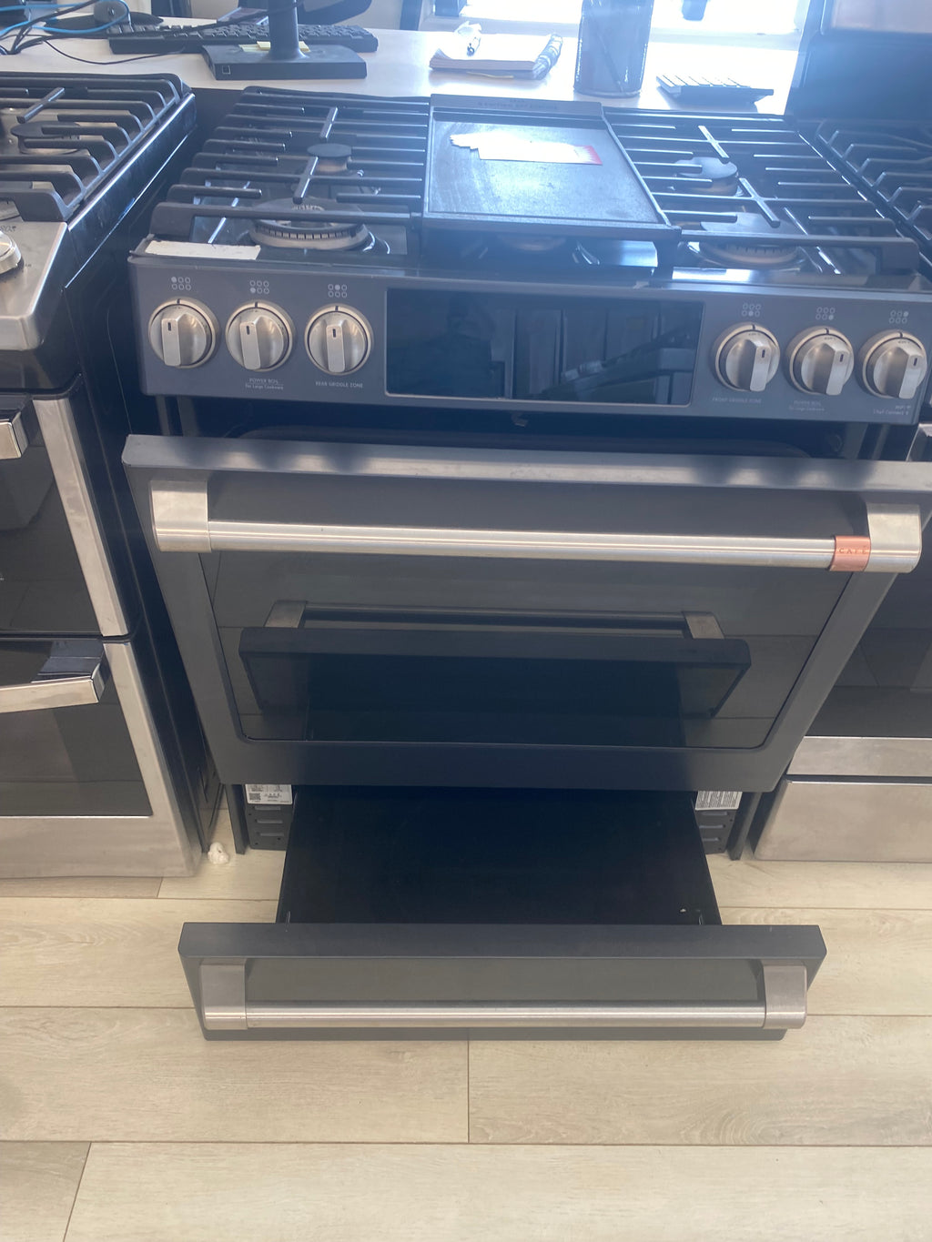 GE Cafe 30” Propane Slide in Stove, 'Scratch and Dent' matte stainless in color.