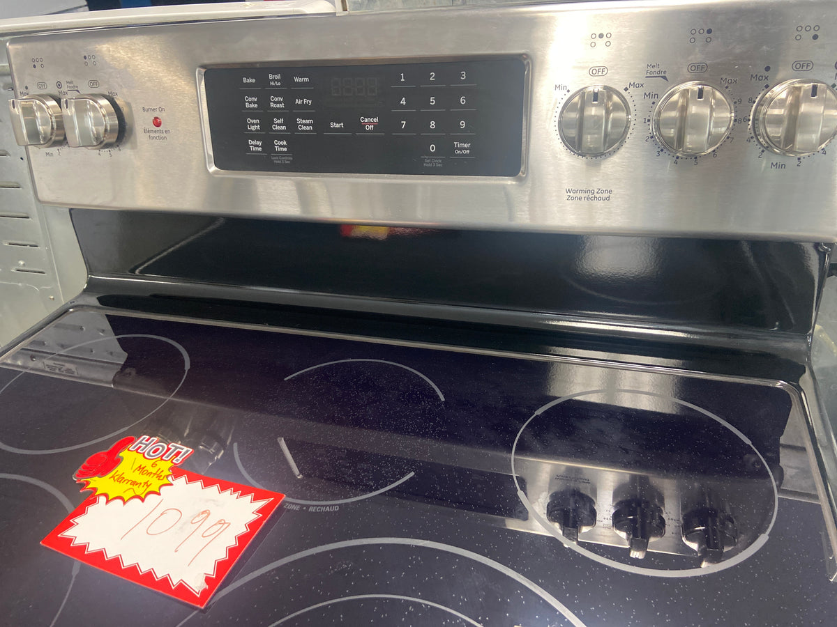 GE glass top stove, “Open Box”,  JCB840ST3SS , 5 burners including the warming zone burner, 6 Months Warranty