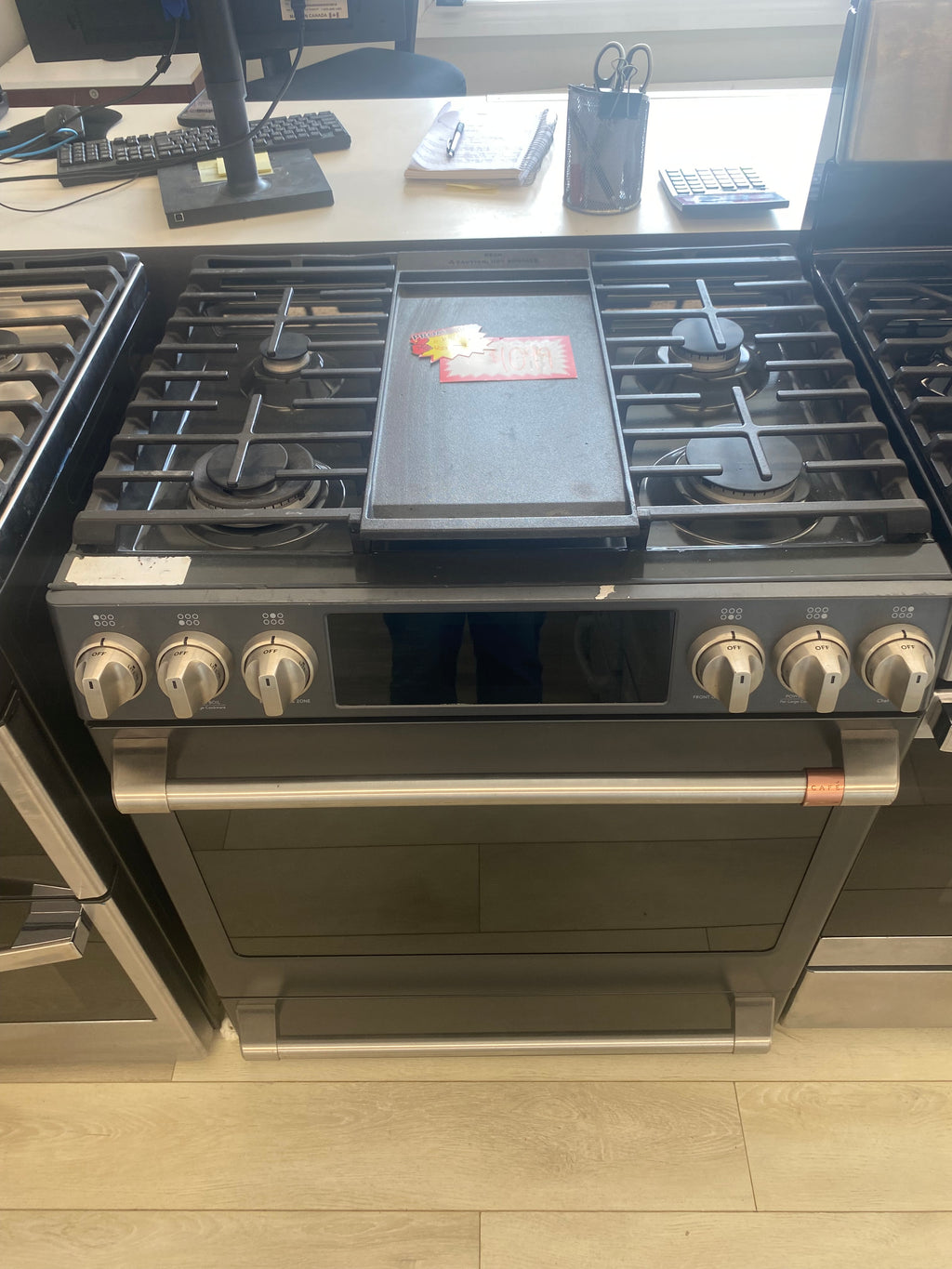 GE Cafe 30” Propane Slide in Stove, 'Scratch and Dent' matte stainless in color.