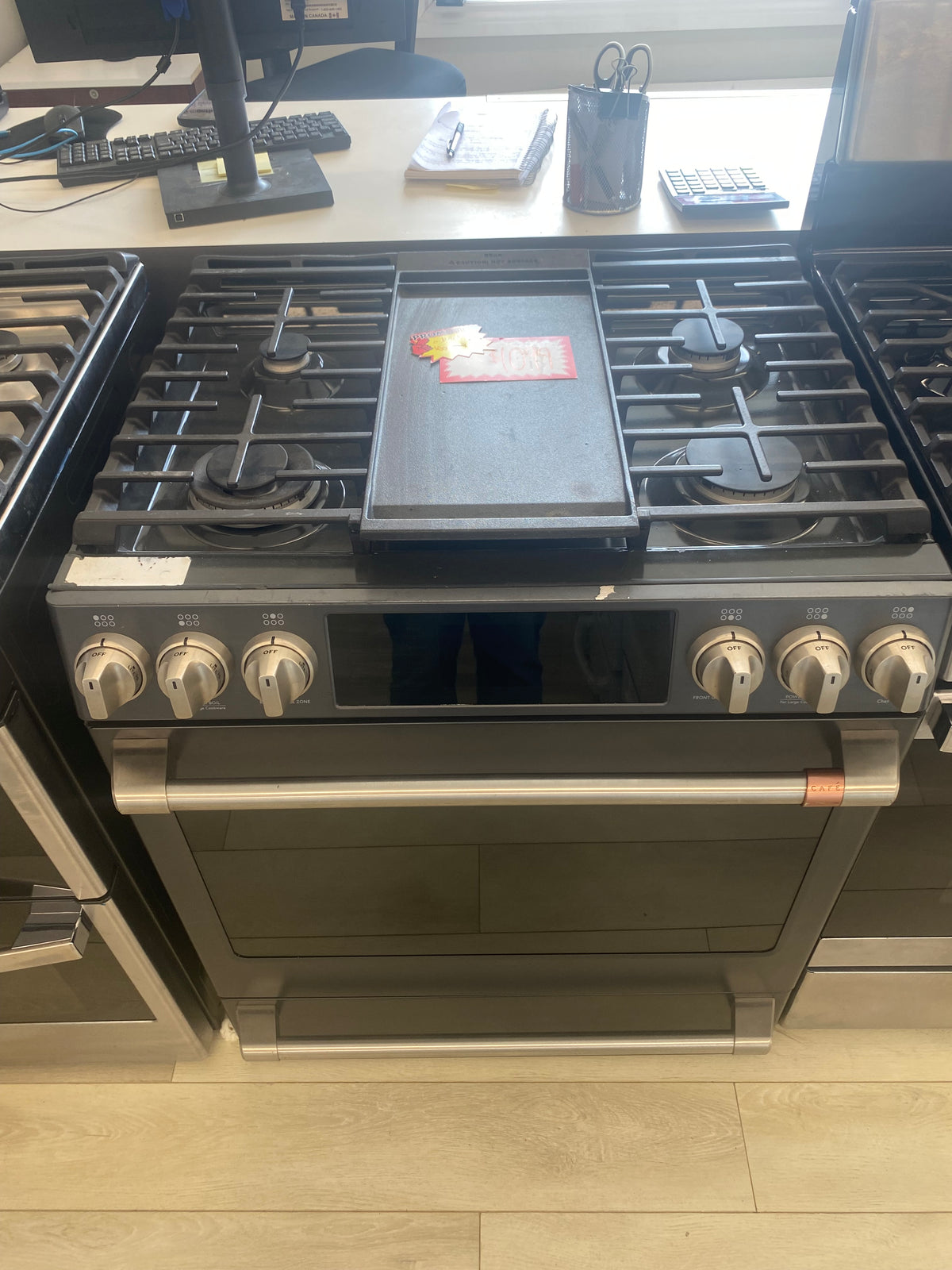 GE Cafe 30” Propane Slide in Stove, 'Scratch and Dent' matte stainless in color.