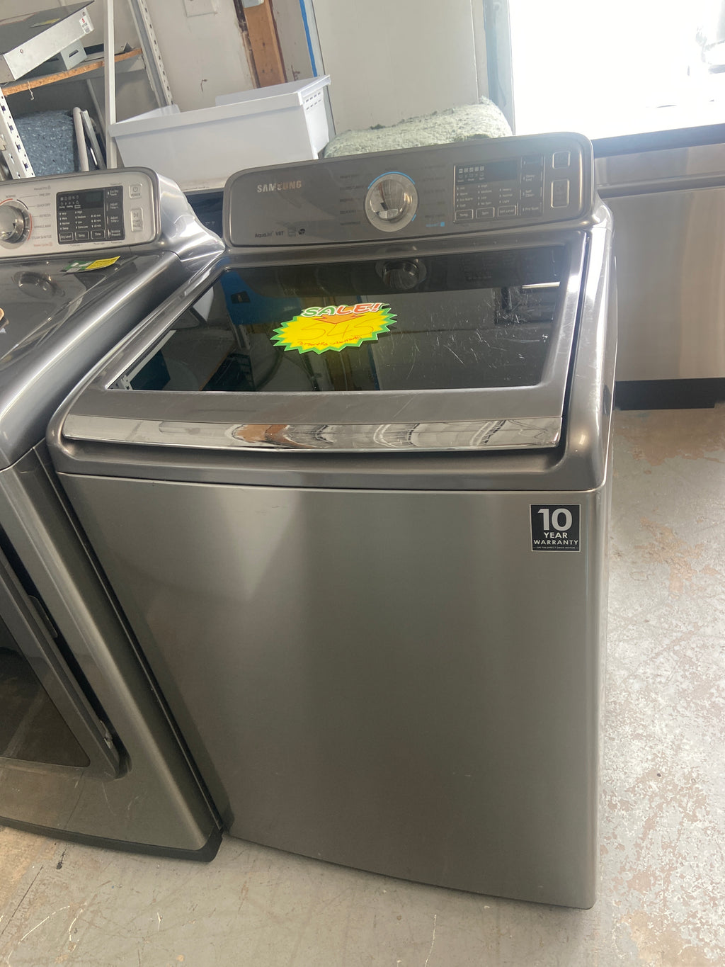 Samsung Grey top load washer, transparent glass cover, he(high efficiency marked), smart care and child lock features, “Refurbished”, 3 Months Warranty.