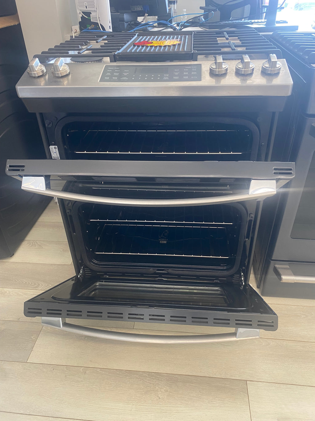 30” GE propane slide in stove "New", Stainless, Double oven