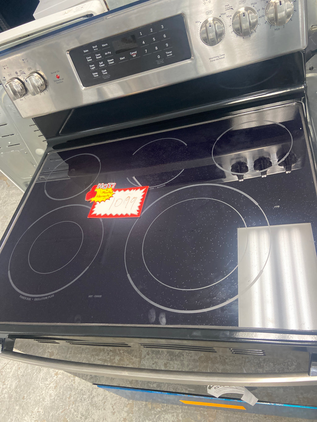 GE glass top stove, “Open Box”,  JCB840ST3SS , 5 burners including the warming zone burner, 6 Months Warranty