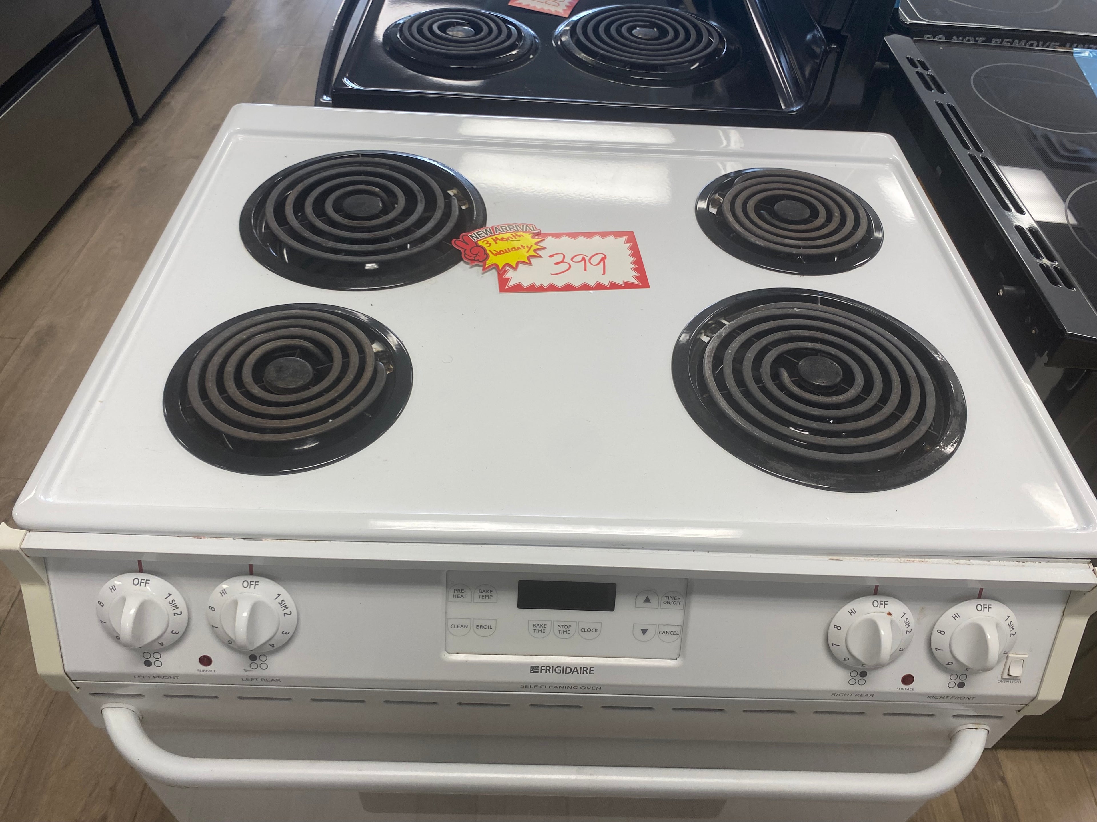 White 31” Frigidaire coil top slide in stove "refurbished"