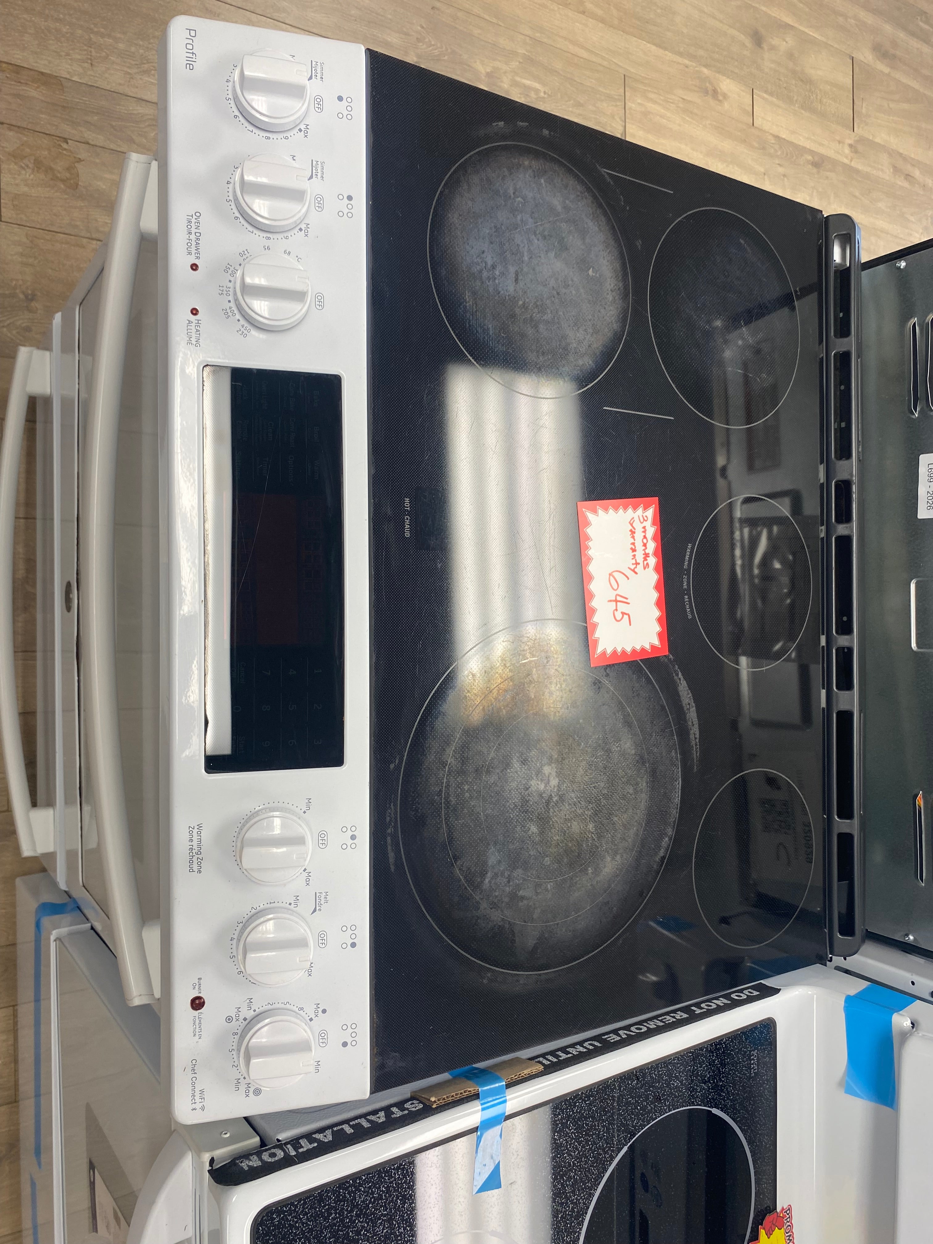 Double oven, Convection 30” Slide in White GE glass top stove "refurbished"